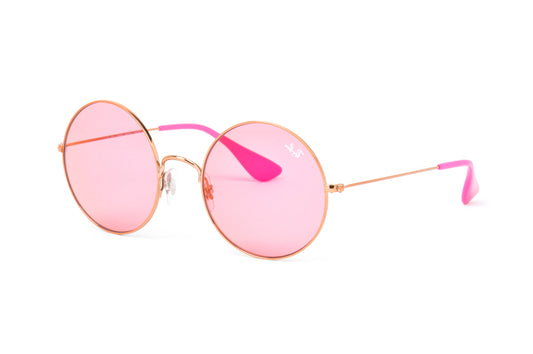 Pink sunglasses with gold frames on a white background